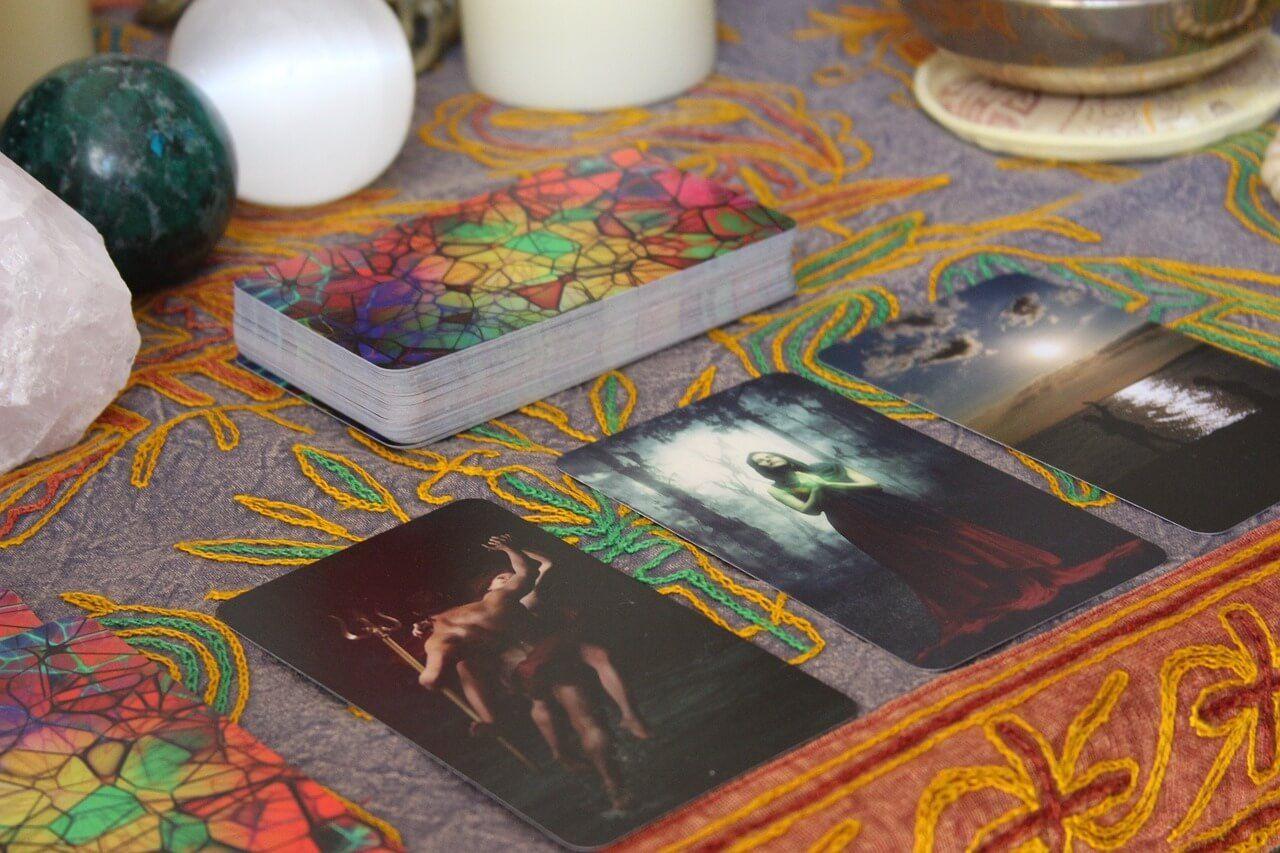 three tarot cards face up on the table